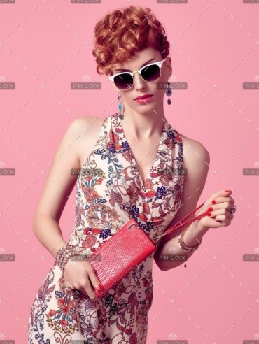 demo-attachment-685-fashion-redhead-model-in-summer-jumpsuit-on-pink-PXX3EL8